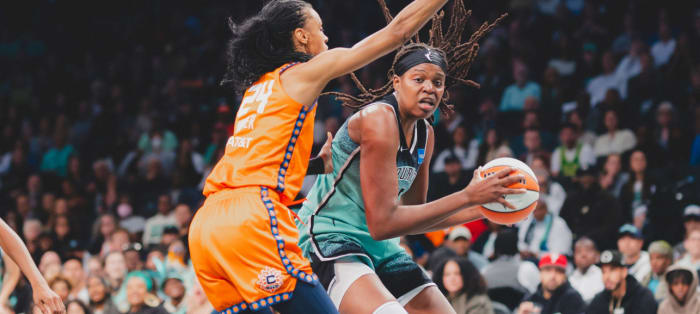 Jonquel Jones (R) earned yet another double-double in Sunday afternoon's Finals berth-clinching victory.